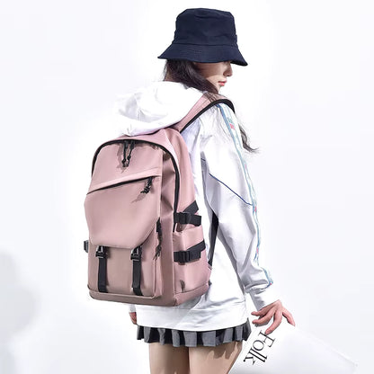 Person wearing a pink backpack with black straps on a white background