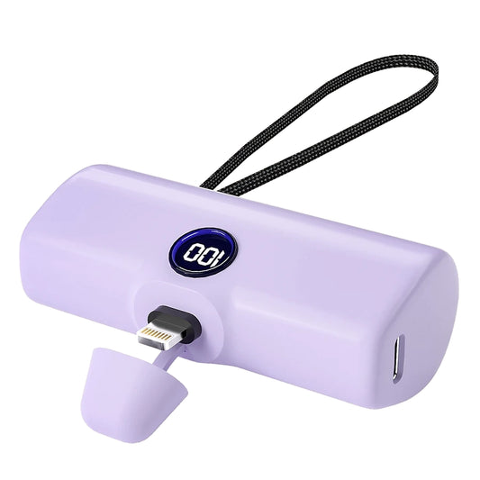 Purple power bank with digital display and charging cables on a white background