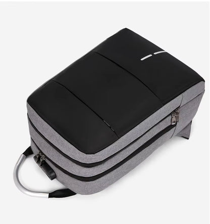 Gray and black backpack on a white background